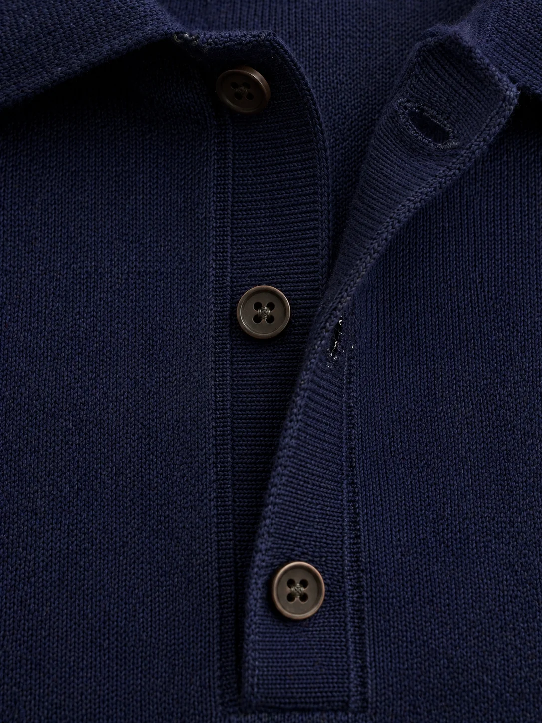 Knit polo sweater button placket construction detail — manufacturer China