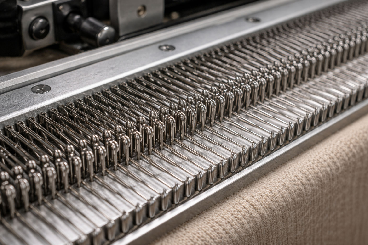 Knitting needle bed detail showing technical knitwear construction at Lin Sweater Factory