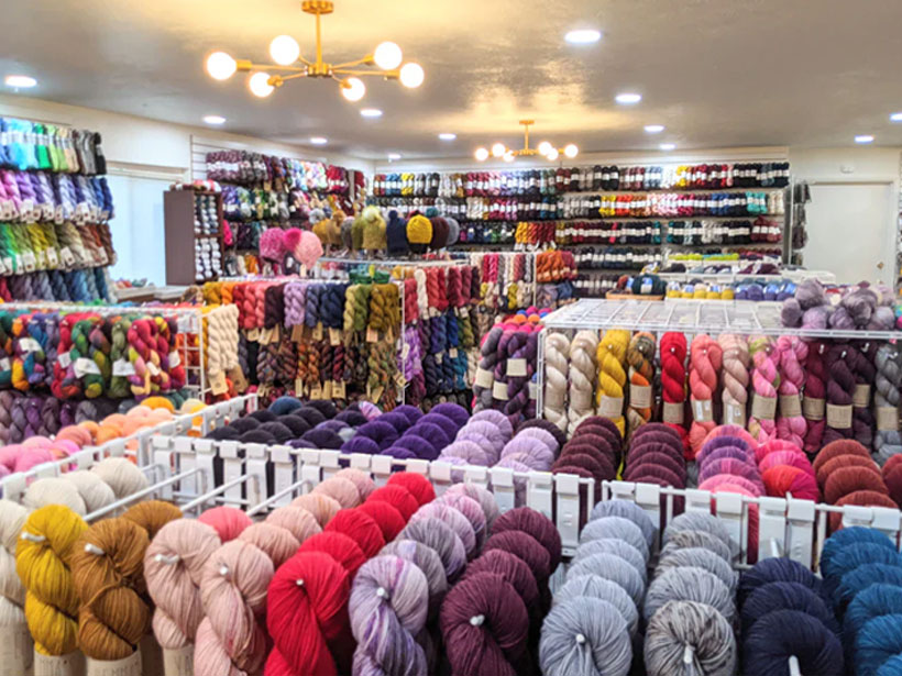 Yarn room supporting knitwear sample planning and material review at Lin Sweater Factory